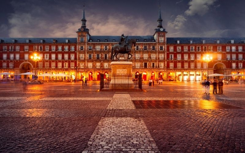 night time at plaza mayor, a central plaza in the city of madrid 
