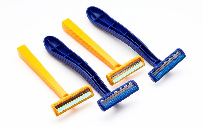 Photo of blue and yellow disposable razors