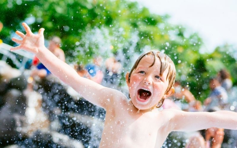 Photo of a boy having fun in water