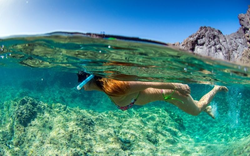 woman with snorkel and mask in water tenerife spain