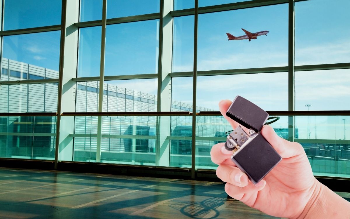 Image of a hand holding a lighter in an airport