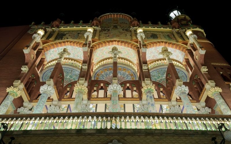 Photo of a colorfulful building with light at night