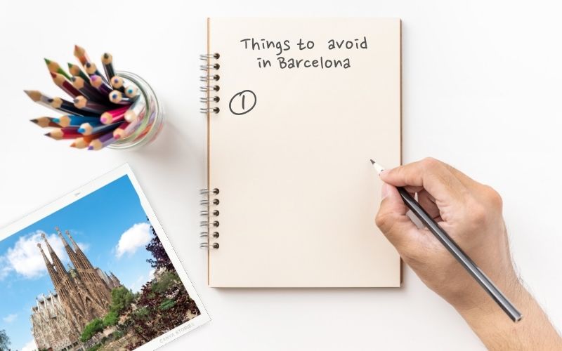 Image showing a notebook, a jar with pens, a phot on left side and a hand holding a pen